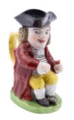A Staffordshire pearlware 'Drunken Parson' toby jug of small size,