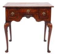 An 18th Century and later walnut crossbanded and feather strung lowboy,