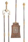A set of three Victorian steel and brass mounted fire tools,