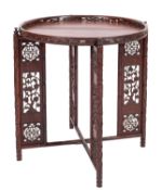 A Chinese carved hardwood circular Tiffin table with a detachable top,