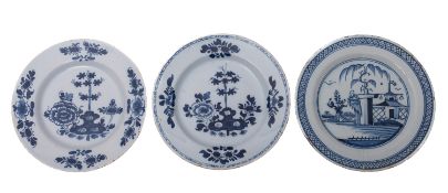 A matched pair of English blue and white delftware plates and one other,