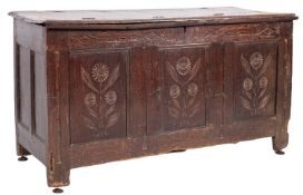 A 17th Century and later oak rectangular plank coffer of small size, on later supports,