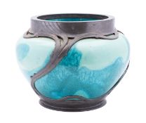 Orivit an Art Nouveau pottery jardiniere the two-tone turquoise body encased in sinuous pewter