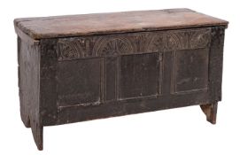 A late 17th Century oak coffer of small size and of plank and panelled construction,