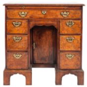 A burr walnut and crossbanded kneehole desk in George II style,