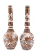 A pair of Japanese Satsuma bottle vases, Meiji period decorated with a lake landscape, birds,