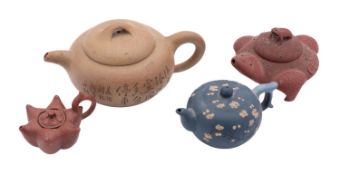 A group of four Chinese Yixing teapots and covers,