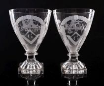 A pair of Masonic glass rummers of tapering form on short knopped stem and lemon squeezer bases,