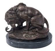 After Antoine-Louis Barye (French, 1795-1875), 'Lion au Serpent', a patinated metal,
