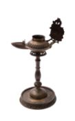 An Indonesian brass oil lamp brass, Sumatra 20th century 33cm [lacking top section].