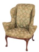 A Howard & Sons, Berners St. stained beech wing frame armchair in the George I style