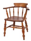 A Victorian elm and ash smokers bow, the curved back with shaped top rail and turned spindle splats,