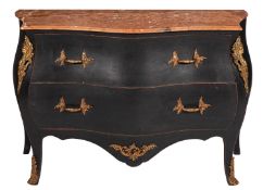 An ebonised and gilt metal mounted serpentine fronted bombe commode in the Louis XV manner,