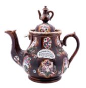 A Measham barge ware teapot of generous proportions, the domed cover with teapot knop,