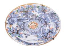 A Japanese Arita charger, Meiji period painted in underglaze blue, iron-red, green,