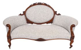 A Victorian carved walnut settee,