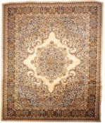 A machine made carpet of Persian design,