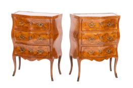 A pair of 19th Century French walnut and crossbanded bombe petit commodes in the Louis XV taste,
