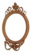 A Victorian gilt gesso oval girandole mirror, with cartouche and foliate scroll cresting,