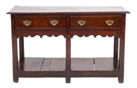 An 18th Century oak dresser base, of small size, with a rectangular moulded top,