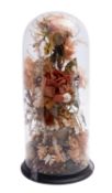 A Victorian waxed flower arrangement, late 19th century; housed within a glass presentation dome,
