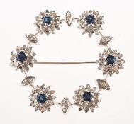 A 1960's 18ct white gold sapphire and diamond brooch,