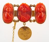 An antique coral cameo brooch with Ottoman Empire coin, a bar brooch,