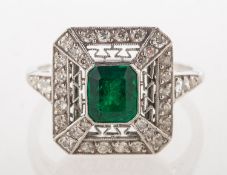 An Art Deco emerald and diamond ring, of geometric rectangular form,