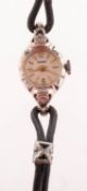 Kered a lady's 9K white gold and diamond cocktail watch the round dial having raised baton and