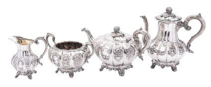 A Victorian matched four-piece Irish silver tea & coffee set, of melon fluted circular form,