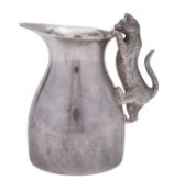 A modern novelty silver cream jug, circular form, with a bellied body and an everting rim,