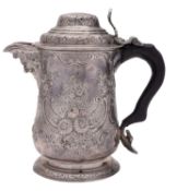 A George III silver tankard, of baluster form, with a domed cover and a chair-back thumbpiece,