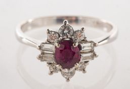 A ruby and diamond ring, claw set to the centre with an oval-cut ruby, ruby approx. 0.