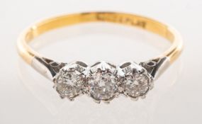 A three stone diamond ring, claw set with three older brilliant-cut diamonds, diamonds approx. 0.