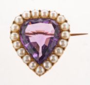A Victorian amethyst and pearl heart shaped brooch,