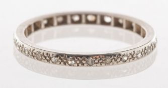A full diamond eternity ring, spaced around the band with grain set single-cut diamonds,