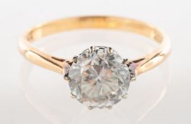 A single stone ring, claw set with a circular-cut white paste stone, marked 9ct, size O, 2.