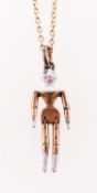 A Victorian peg doll charm pendant with chain, an articulated enamel peg doll charm pendant,