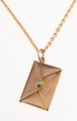 An early 20th century envelope pendant with chain,