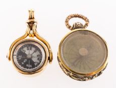 A swivel fob compass and one other compass, a swivel fob compass,