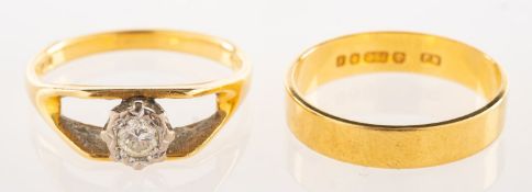 An 18ct gold diamond solitaire ring and an 18ct gold wedding band, a 1970's 18ct gold ring,