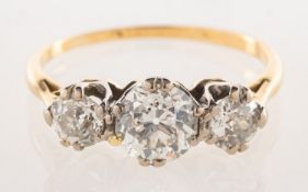 A three stone diamond ring, claw set with three old-cut diamonds, diamonds approx. 1.