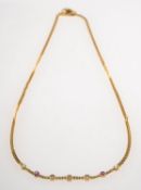 An 18ct gold diamond, amethyst and peridot necklace,