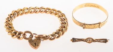 A mixed group of jewellery, including a curb link bracelet with heart padlock and safety chain,