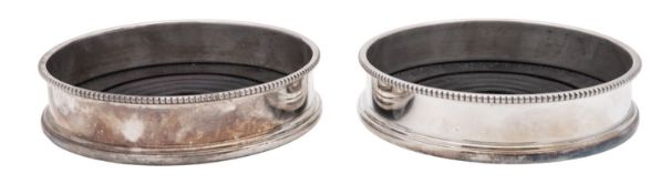 A pair of Elizabeth II silver mounted wooden wine coasters, circular form,