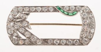 An Art Deco diamond and emerald brooch, of rounded rectangular geometric and foliate form,