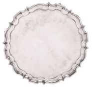 An Edwardian silver salver, of shaped circular outline,