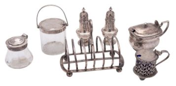 A mixed lot of silver condiments etcetera, to include a late Victorian toast rack, by Hukin & Heath,