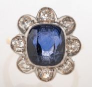A sapphire and diamond cluster ring, of flowerhead form,