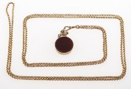 An antique lion fob and guard chain,